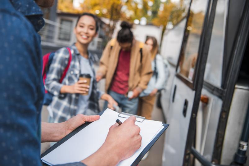 Tourists getting on the bus